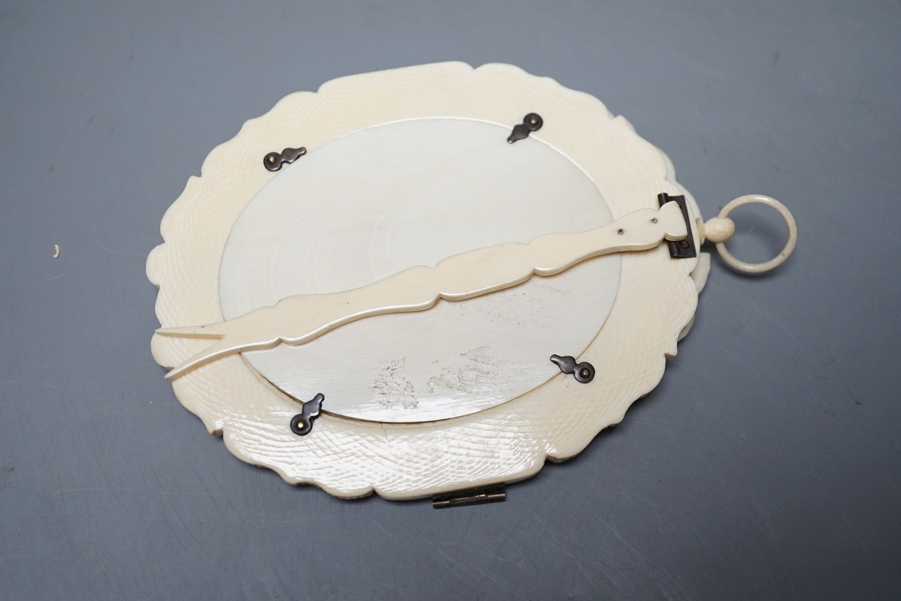 A carved and pierced ivory framed miniature. ‘Edith wife of C.Constable Curtis Esq. Collingshaw Newark - Painted by K.Wilfred Collyer 8th October 1892’ to reverse, 11.5cm high